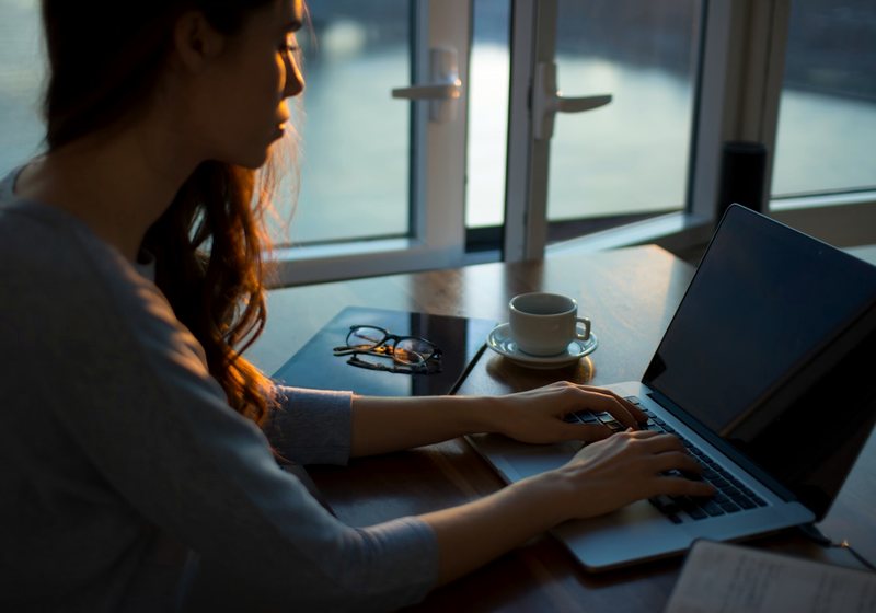 Freelancer working focused on a laptop