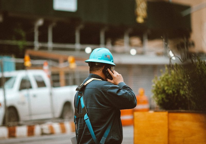 Contractor on the phone at a job site