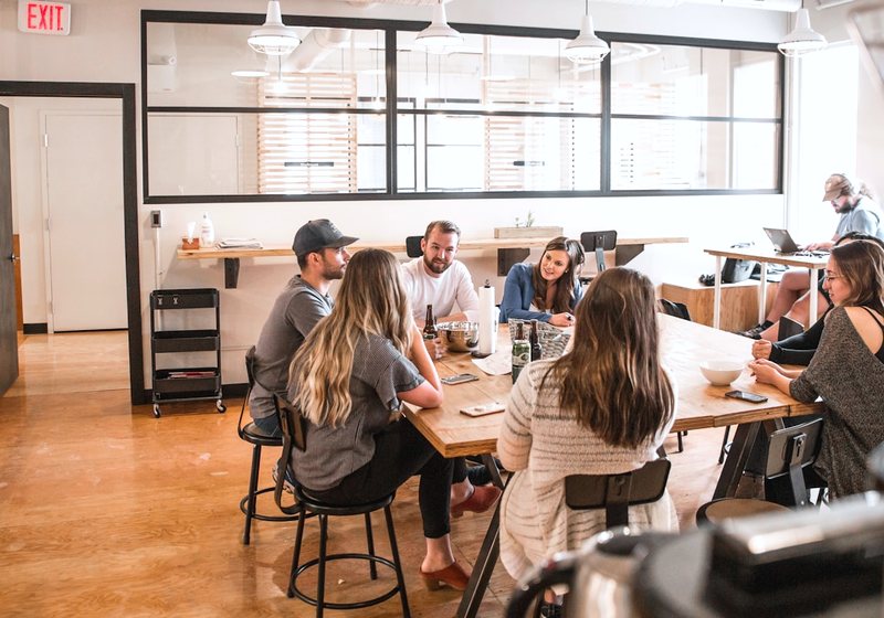 Creative agency team meeting to review a website design project