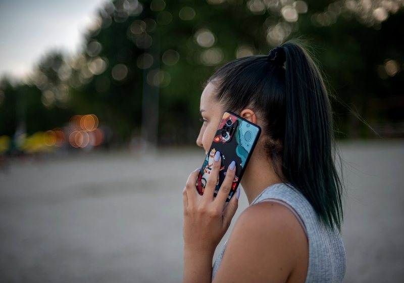 Woman checking her phone outdoors