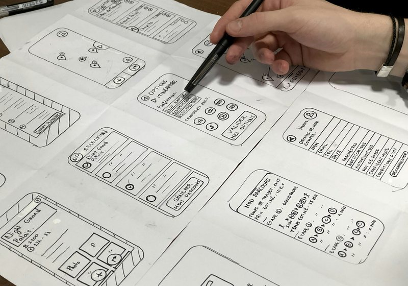Hand-drawn wireframes for a mobile app interface