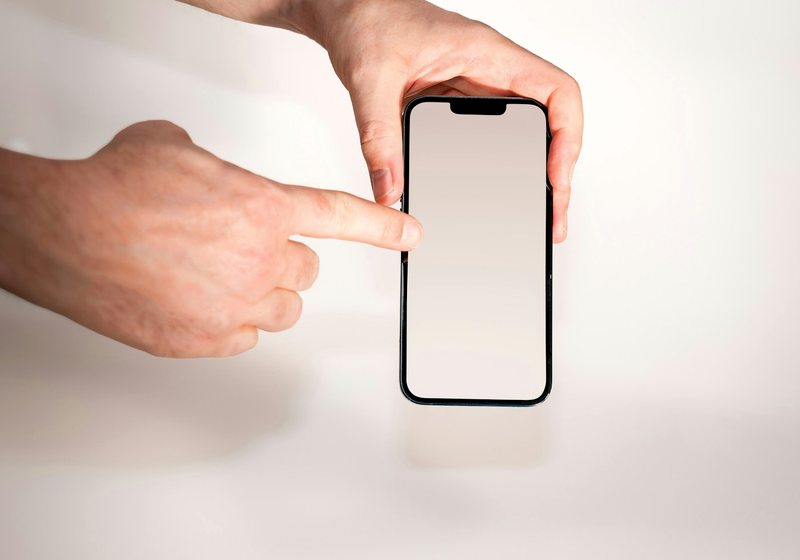 Finger tapping a smartphone screen