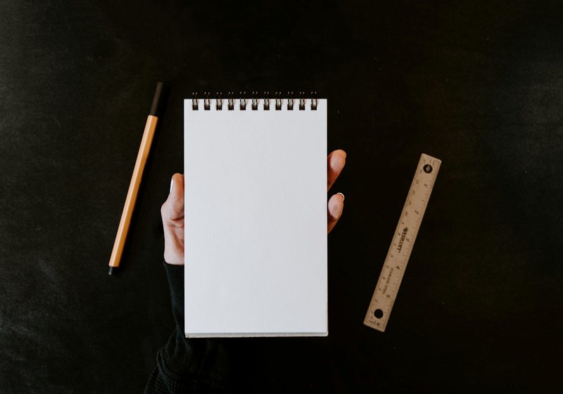 Blank notepad and pencil ready for a checklist