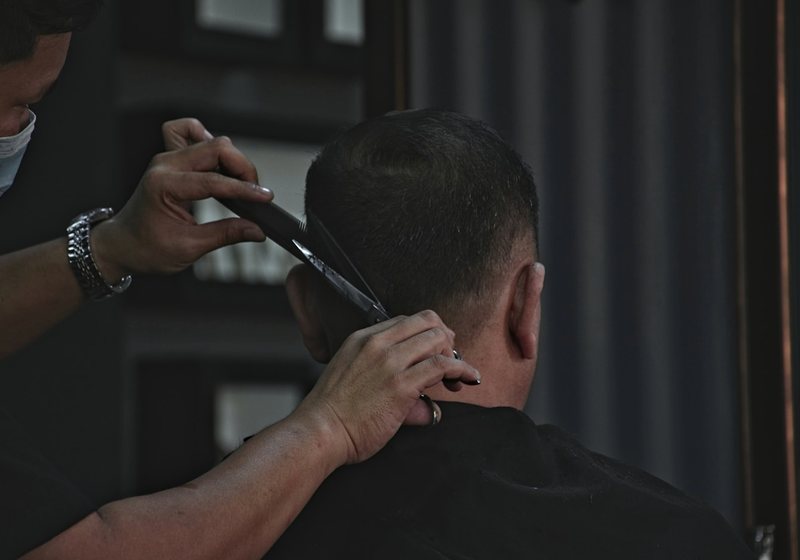Stylist performing a haircut for a client